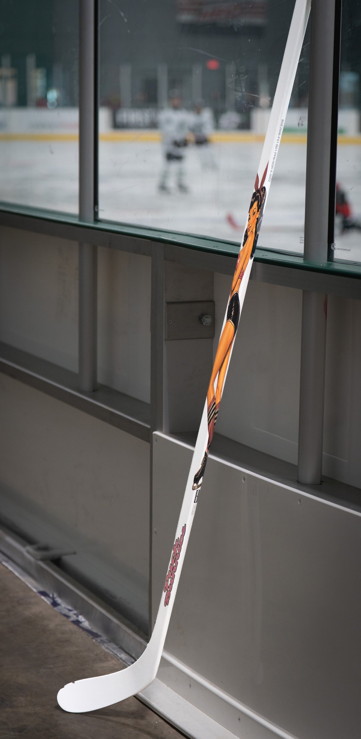 Puck Bunnies PB1 full white hockey stick at the rink